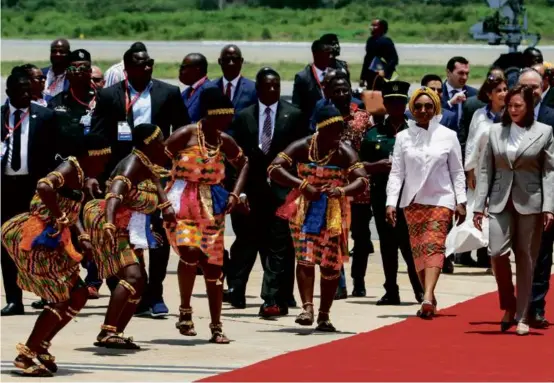  ?? NIPAH DENNIS/AFP VIA GETTY IMAGES ?? Vice President Kamala Harris was welcomed by dancers and Ghanaian leaders and officials as she arrived in Accra Sunday.