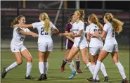  ?? MICHAEL MCCONNEY - FOR MEDIANEWS GROUP ?? Hope Flanegin, left, celebrates with her Spring-Ford teammates during their PAC semifinal win over Pottsgrove Tuesday.