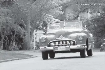 ??  ?? The local chapter of the Vintage Car Club of Canada loaned the Victoria Operatic Society a 1947 Buick convertibl­e so it could film a car-chase scene in Uplands for the Sunset Boulevard production.