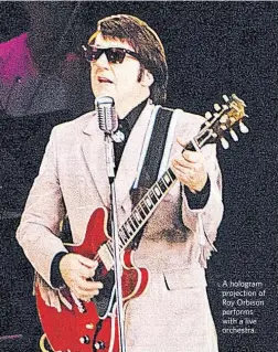  ?? BASE HOLOGRAM PRODUCTION­S ?? A hologram projection of Roy Orbison performs with a live orchestra.