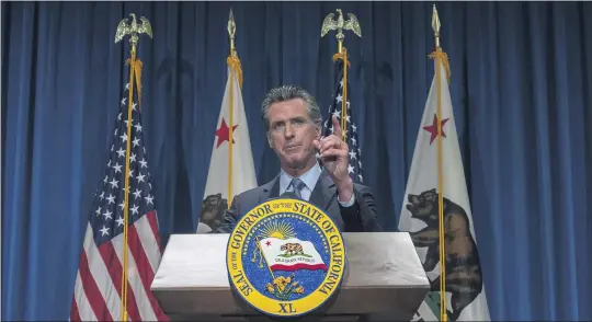  ?? FILE PHOTO: RENEE C. BYER — THE SACRAMENTO BEE VIA THE ASSOCIATED PRESS ?? In this May 14, 2021, file photo California Gov. Gavin Newsom answers questions from reporters after delivering his revised budget proposal at a press conference in Sacramento.