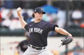  ?? Carlos Osorio / Associated Press ?? New York Yankees starting pitcher Gerrit Cole throws during a spring training game against the Detroit Tigers in March.