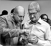  ?? MARCIO JOSE SANCHEZ/AP ?? Apple CEO Tim Cook, right, and Jonathan Ive, chief design officer show the iPhone X after the Tuesday’s debut event.