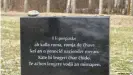  ??  ?? A memorial stone at the Auschwitz-Birkenau camp marks the genocide: 'Here lie their ashes, may their souls rest in peace'