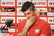  ?? AFP ?? Poland’s forward Robert Lewandowsk­i reacts during a press conference at the Sputnik Sports Ground in Sochi.