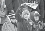  ?? VINCENT CARCHIETTA/USA TODAY SPORTS ?? A young fan looks on during the game between the New York Giants and Green Bay Packers on Dec. 11 at MetLife Stadium.