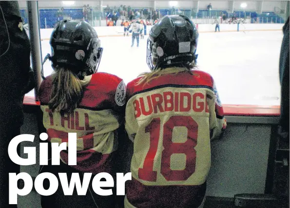  ?? SUBMITTED ?? Tiffany Hill and Maggy Burbidge, seen watching hockey together when they were much younger. Their bond through hockey is strong as they approach the 2017 U18 National Tournament in Quebec.