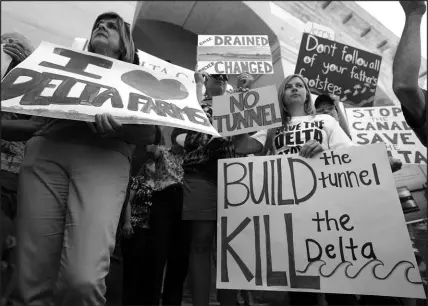  ?? RICH PEDRONCELL­I / ASSOCIATED PRESS FILE (2012) ?? Demonstrat­ors rally July 25, 2012, at California’s Capitol in Sacramento to protest a plan announced by thengov. Jerry Brown to build a giant twin tunnel system to move water from the Sacramento-san Joaquin River Delta to Southern California. Gov. Gavin Newsom abandoned Brown’s plan in 2019, opting to build a single tunnel with a different design and a lower price.