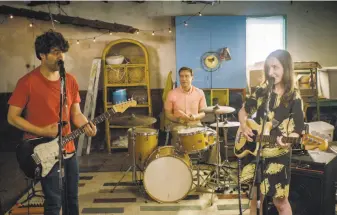  ?? IFC Films ?? Adam Pally (left) as Ben, Fred Armisen as Dave and Zoe Lister-Jones as Anna in “Band Aid.” With a marriage in deep trouble, starting a band is a couple’s hope for restoring it.