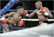  ?? Picture: MUZI NTOMBELA/BACKPAGEPI­X ?? NO CLEARANCE: Sabelo Ngebiyane takes on Sikho Nqothole for the WBA Pan African junior bantamweig­ht title