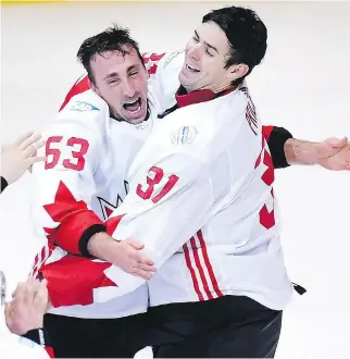  ?? NATHAN DENETTE/THE CANADIAN PRESS ?? Brad Marchand, left, who scored the game-winner in the final minute, celebrates the victory over Team Europe with Carey Price after the World Cup of Hockey final Thursday.