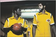  ?? WARRICK PAGE/HBO VIA AP ?? This image released by HBO shows Quincy Isaiah, portraying Magic Johnson (left) and Solomon Hughes, portraying Kareem Abdul-Jabbar, in a scene from the series “Winning Time: The Rise of the Lakers Dynasty.”