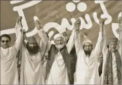  ?? AFP ?? 26/11 mastermind Hafiz Saeed (second from right) has recently floated a political party (Mili Muslim League) to participat­e in Pakistan’s general elections due this month