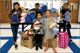  ?? Buy this photo at YumaSun.com PHOTO BY RACHEL ESTES/YUMA SUN ?? STUDENTS DANNA SANCHEZ, ANTHONY CASILLAS, ARIA ICEDO, HAYDEN FOPPE AND VIENNA ORTIZ helped sew drawstring bags and/or collect toiletries to fill them. They donated all of the items to Crossroads Mission to “help people when they’re in need.”