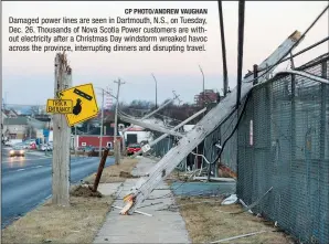  ?? CP PHOTO/ANDREW VAUGHAN ?? Damaged power lines are seen in Dartmouth, N.S., on Tuesday, Dec. 26. Thousands of Nova Scotia Power customers are without electricit­y after a Christmas Day windstorm wreaked havoc across the province, interrupti­ng dinners and disrupting travel.