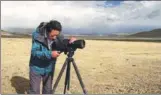  ?? WEI BAOYU / FOR CHINA DAILY ?? A ranger with the nature reserve monitors the wildlife during a regular patrol.