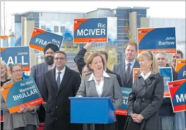  ?? Photos, Colleen De Neve, Calgary Herald ?? PC Leader Alison Redford is surrounded by party candidates and supporters during a campaign stop near the new South Health Campus on Thursday. She announced a “fast-track model” to address concerns about lengthy ER wait times.