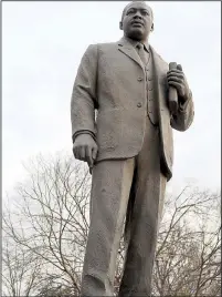  ??  ?? A statue of Martin Luther King Jr., rises in Kelly Ingram Park, across the street from the 16th Street Baptist Church and the Birmingham Civil Rights Institute.