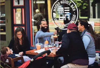  ?? Erik Trautmann / Hearst Connecticu­t Media ?? Local patrons dine at Mecha Noodle Bar on Washington Street in Norwalk in May 2020.