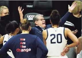  ?? David Butler II / USA TODAY ?? UConn coach Geno Auriemma talks to his team during a break in the second half against Marquette on Monday at Harry A. Gampel Pavilion. UConn won 63-53.