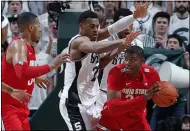  ?? AL GOLDIS — THE ASSOCIATED PRESS ?? Ohio State’s E.J. Liddell, right, maneuvers against Michigan State’s Xavier Tillman, center, as Ohio State’s Kaleb Wesson watches during the first half March 8in East Lansing, Mich.