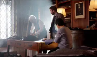  ??  ?? Exacting: Scenes from the Staysure TV ad, featuring real-life Italian tailors