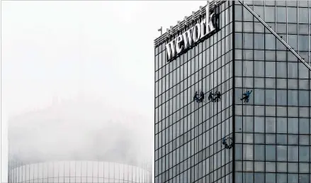  ?? JOHN SPINK / JSPINK@AJC.COM ?? uth Beach Glass window washers work on the 36-story 101 Marietta Street building Wednesday in downtown Atlanta as clouds obscure the Westin Peachtree Plaza. Channel 2 Action News meteorolog­ist Eboni Deon said today’s rain chance is 60%. By Friday, Atlanta could see highs in the low 80s. A cold front is expected to move through Friday, bringing some early showers. Behind the front, Deon said, dry air and sun returns for the weekend.