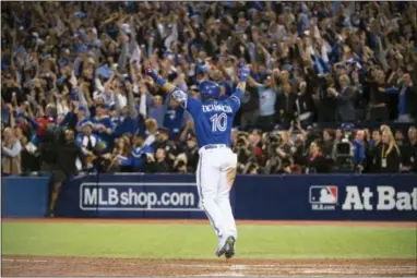  ?? NATHAN DENETTE — THE CANADIAN PRESS VIA AP ?? Toronto’s Edwin Encarnacio­n celebrates his game-winning walk-off three-run home run against the Baltimore Orioles during the 11th inning in Toronto Tuesday.