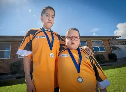  ?? PHOTO: GRANT MATTHEW/STUFF ?? Brothers Matthew Britz, 14, and Ethan Britz, 8, are back after competing in the Halberg Junior Disability Games last weekend.