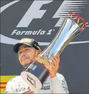  ?? AFP ?? Mercedes' British driver Lewis Hamilton celebrates on the podium after beating Sebastian Vettel to win the Spanish GP.