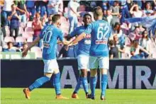 ?? Reuters ?? Napoli’s Amadou Diawara celebrates after scoring the second goal with teammates during a Serie A match against Chievo Verona at Stadio San Paolo.