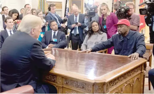  ?? SAUL LOEB/AFP VIA GETTY IMAGES ?? President Donald Trump meets with rapper Kanye West in the Oval Office in 2018.