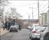  ?? Diego Mendoza-moyers / Times Union ?? A SWAT team surrounded a house on First Street in Albany on Saturday after believing that a suspect was inside after reports of shots being fired.