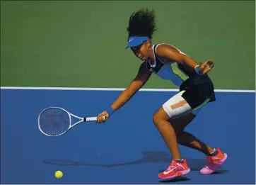  ?? SETH WENIG — THE ASSOCIATED PRESS ?? Naomi Osaka returns a shot during her 6-3, 6-7, 6-2 victory over Marta Kostyuk in the third round of the U.S. Open.