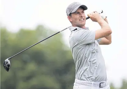  ??  ?? Webb Simpson tees off on the 12th hole during the first round of the Greenbrier Classic.