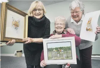  ??  ?? Janet Pell, Val Barker and Tess Stroud all smiles with their pieces of art. 180211d