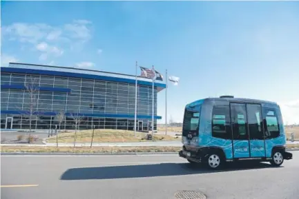  ?? Lindsay Pierce, The Denver Post ?? The six-seat EZ-10 driverless shuttle manufactur­ed by French developer EasyMile travels on a dedicated stretch of road near the Technology and Operations Center of Panasonic Enterprise Solutions Co. on Monday.