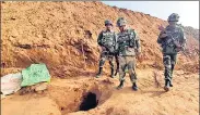  ??  ?? Security officers standing near the mouth of the 150-metre undergroun­d tunnel in Kathua district on Wednesday.
