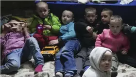  ?? ?? Displaced: Children play with toys in a bomb shelter in Mariupol