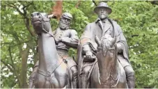  ?? PHOTOS BY SEAN DOUGHERTY, USA TODAY ?? Likenesses of Thomas “Stonewall” Jackson, left, and Robert E. Lee stand in Wyman Park in Baltimore.
