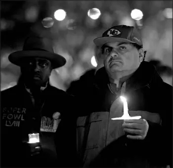  ?? CHARLIE RIEDEL / ASSOCIATED PRESS ?? People attend a candleligh­t vigil on Feb. 15 for victims of a shooting at a Kansas City Chiefs Super Bowl parade in Kansas City, Mo. More than 20 people were injured and one woman killed in the shooting near the end of the Feb. 14 rally at nearby Union Station.