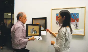  ?? Jeannette Ross / Hearst Connecticu­t Media ?? Above, Ed MacEwen, Wilton Library’s art chairman, and volunteer Petra Saldutti hang a painting for the library’s exhibition “All About Color,” which opened May 10. Below, Mesa Display by Erin Nazzaro.