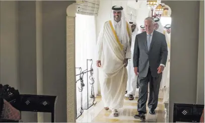  ?? Alexander W. Riedel ?? U.S. State Department Emir Tamim bin Hamad al-thani welcomes U.S. Secretary of State Rex Tillerson on Tuesday to Sea Palace, his official residence in Doha, Qatar. Tillerson sealed a deal Tuesday to intensify Qatar’s counterter­rorism efforts.