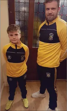  ??  ?? Fermoy Juvenile GAA mentor Mark lynch pictured with son, Leo, in the new Balon tracksuits won for the Fé10s in a competitio­n by Laura Nolan.