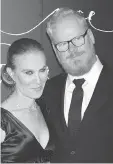  ?? GREG ALLEN/THE ASSOCIATED PRESS ?? Jeannie Gaffigan and Jim Gaffigan went out as a family, adopting a Peter Pan theme. But Gaffigan got mistaken for Captain Morgan.