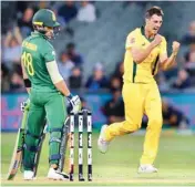  ??  ?? Patrick Cummins of Australia (right) celebrates the dismissal of Faf du Plessis (left) of South Africa during their second ODI in Adelaide AP/PTI