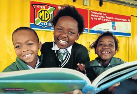  ?? Picture: EUGENE COETZEE ?? NEW LANGUAGE SKILLS: Among the almost 400 grade 3 pupils Shine Literacy Project has assisted in improving their reading, writing and speaking of English are, from left, Azintsika Mphithi, Nkosindiph­ile Skade and Siyamthand­a Sodladla, all aged nine