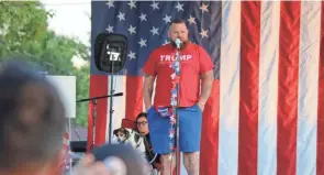  ?? PORT CLINTON NEWS-HERALD FILE PHOTO ?? J.R. Majewski, the Port Clinton man who painted a Trump banner across his entire front yard, hosted a gathering at his home to watch the first presidenti­al debate of 2020.