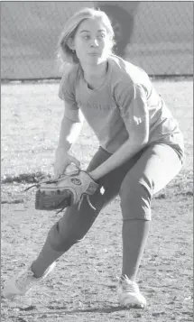  ?? Fred Conley • Times-Herald ?? A Palestine-Wheatley Lady Patriot player prepares to make a throw during a recent practice. Both the P-W girls and the Patriots baseball team were scheduled to play a conference doublehead­er today at DeWitt.