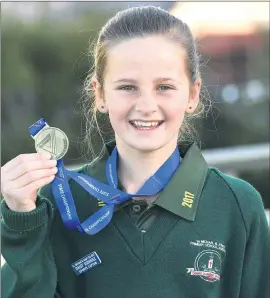  ?? Picture: PAUL CARRACHER ?? HOBART BOUND: Horsham Ss Michael and John’s Primary School student Daisy Sudholz celebrates back-to-back School Sport Victoria cross country championsh­ip success.